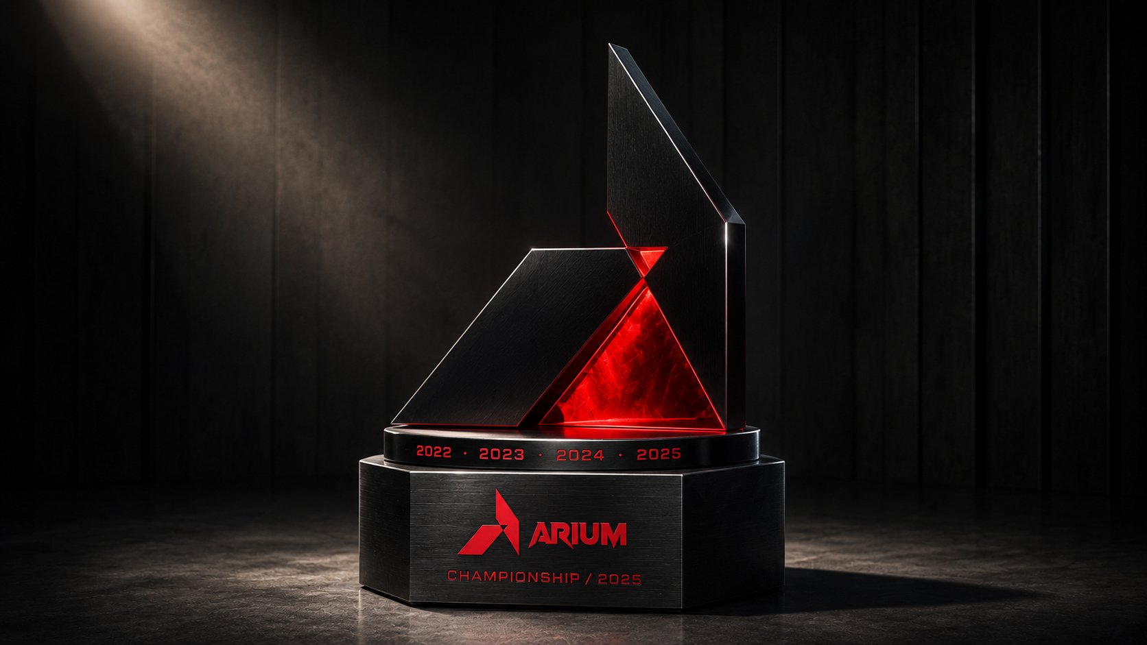 ARIUM Championship trophy editorial hero, sculptural geometric trophy machined from polished black anodized aluminum with a glowing red translucent inner cut, hexagonal brushed-graphite plinth engraved with the chevron mark + ARIUM wordmark + year ring, single museum spotlight
