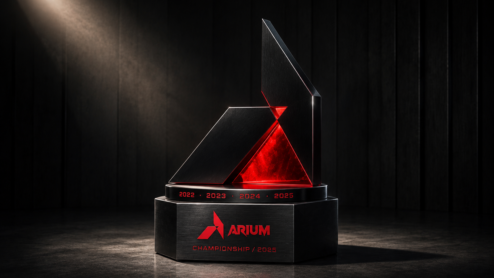 ARIUM Championship trophy editorial hero — sculptural geometric trophy machined from polished black anodized aluminum with a glowing red translucent inner cut, hexagonal brushed-graphite plinth engraved with the chevron mark + ARIUM wordmark + year ring, single museum spotlight