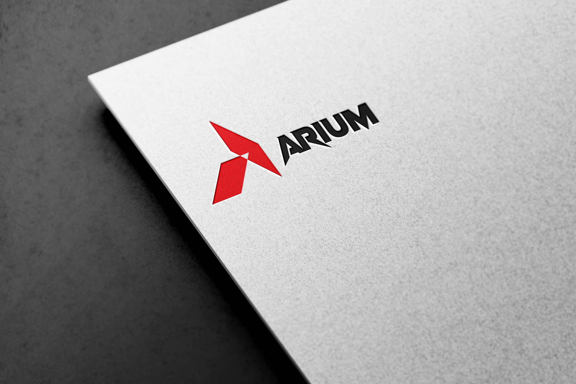 ARIUM letterhead, macro detail of the embossed chevron monogram
