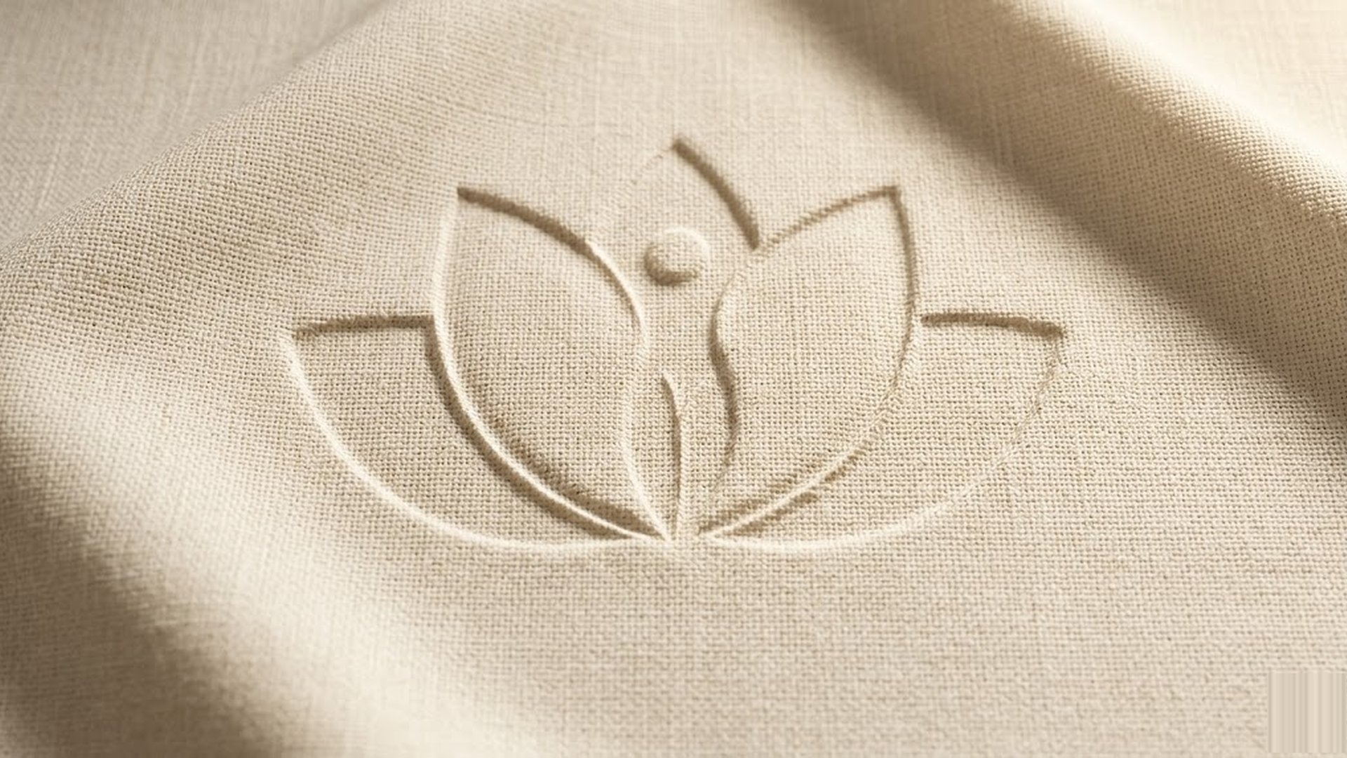 ETERNA lockup blind-embossed on cream linen paper