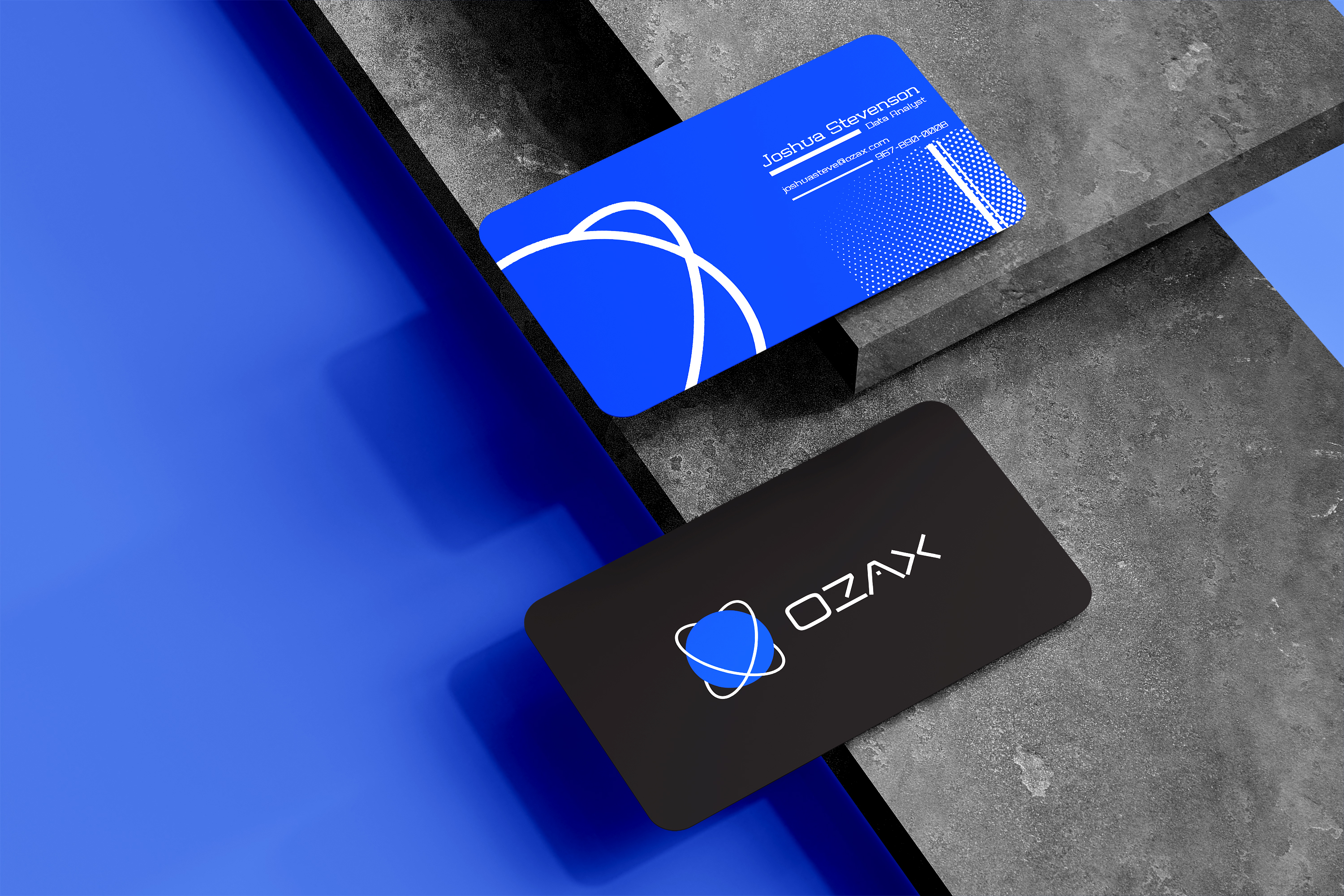 OZAX business card — matte black with electric blue accent