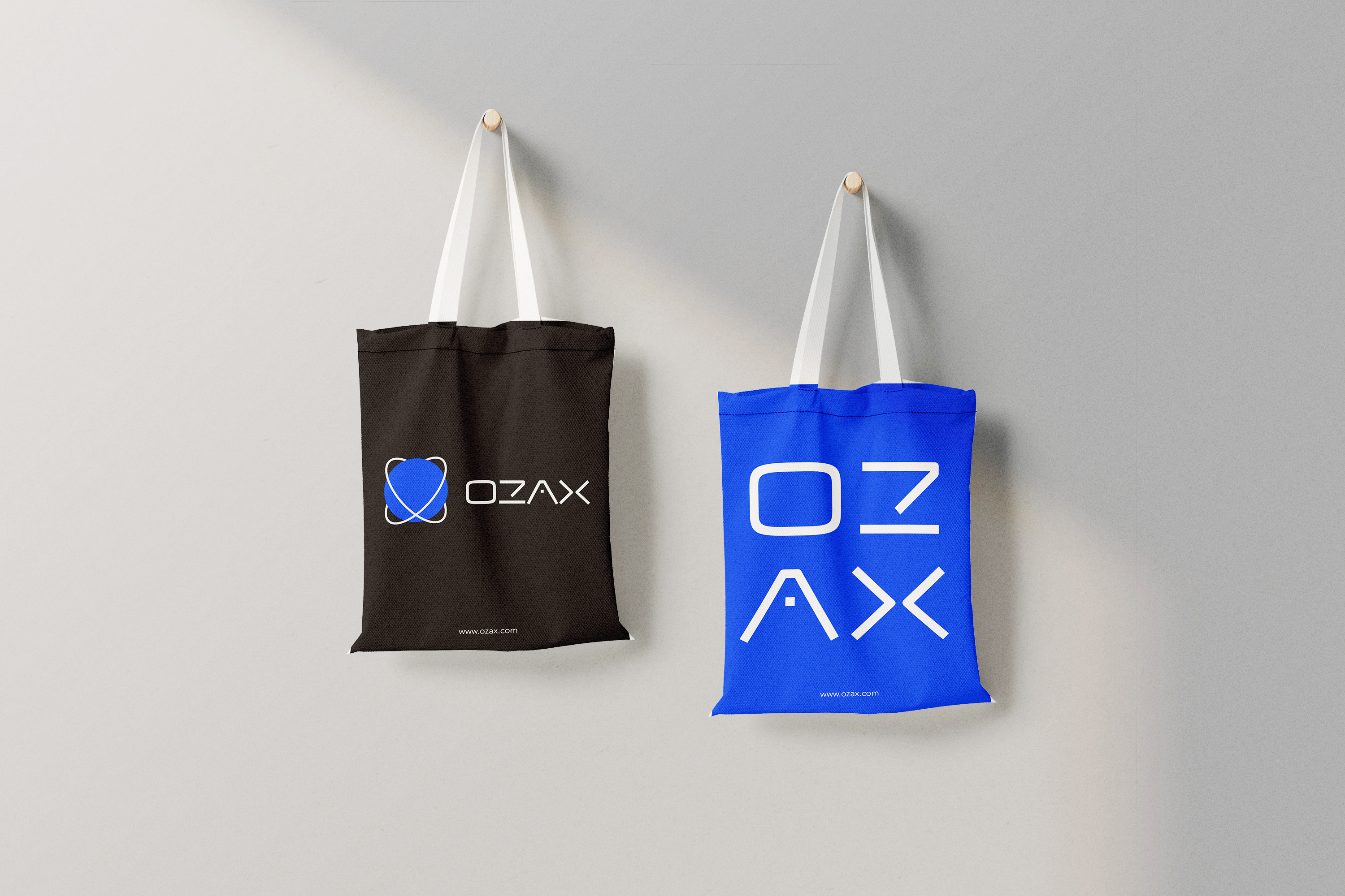 OZAX branded tote bag with the orbital mark